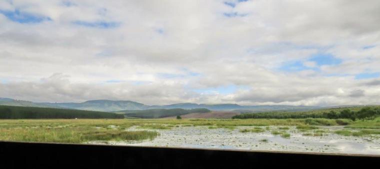 View from the bird hide showing the extent of the wetland area - to the base of the hills in the distance.